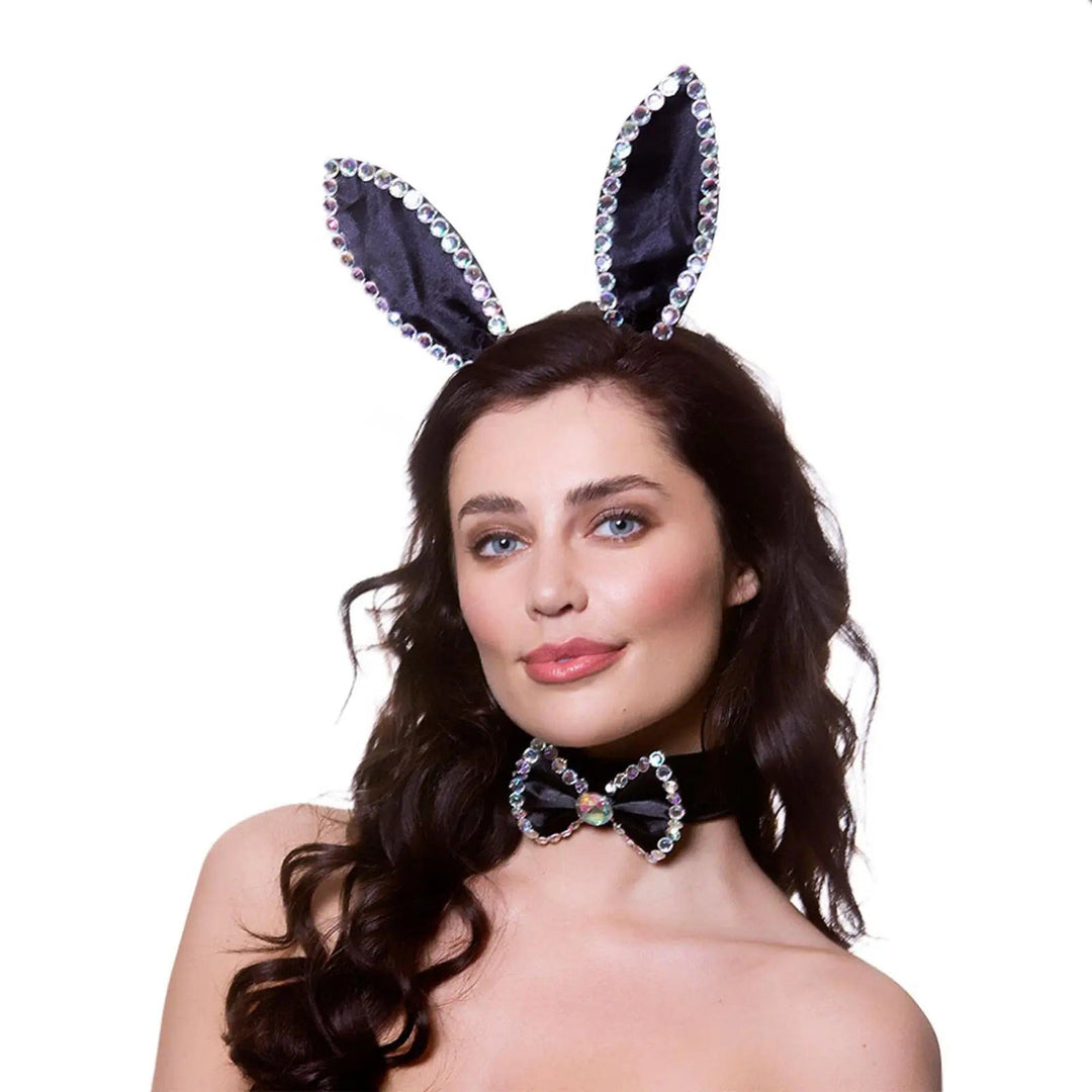 Woman wearing black bunny ears and bow ties with sparkling diamante trim for fancy dress costumes