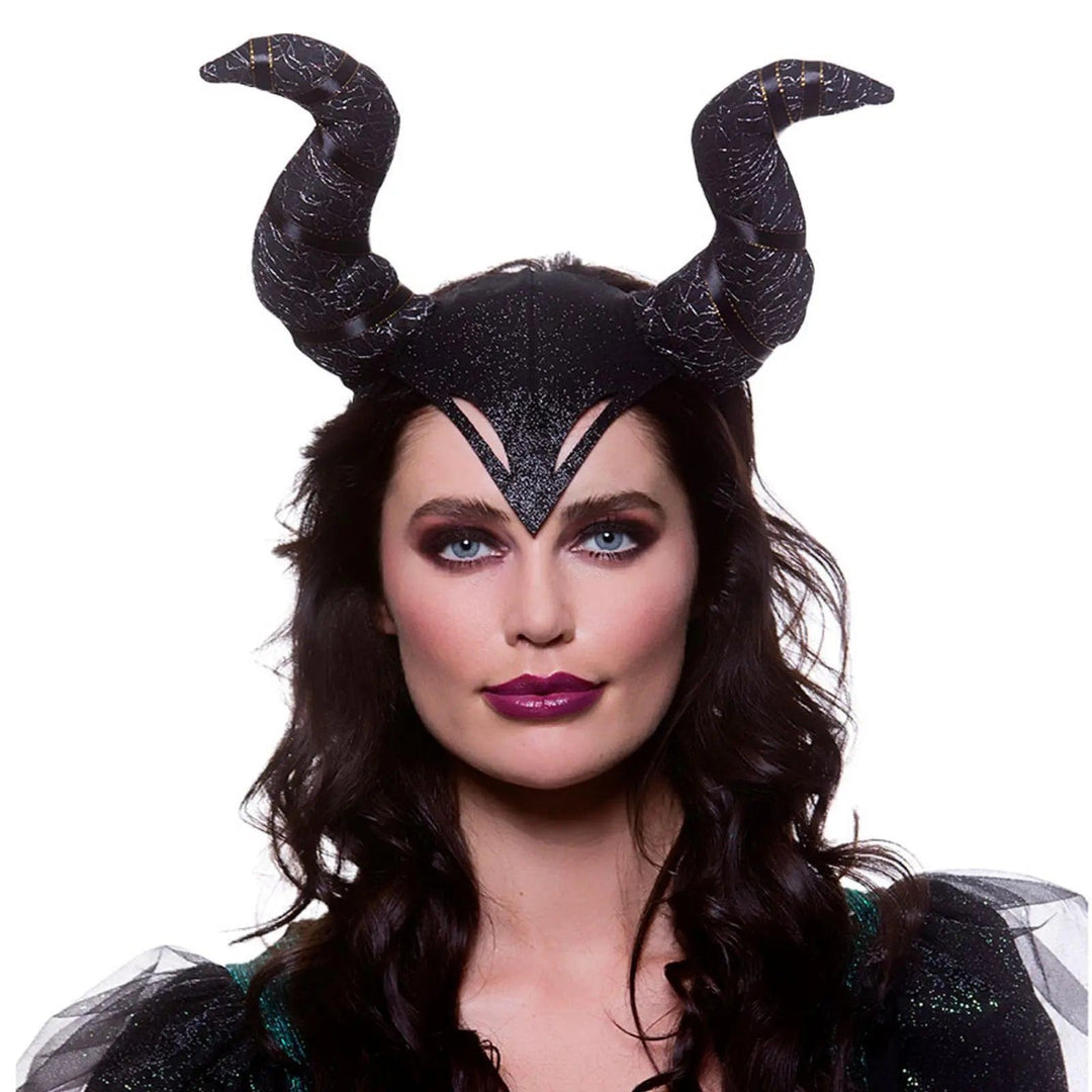 Woman wearing a set of gothic horns on a headband for devil queen fancy dress costumes