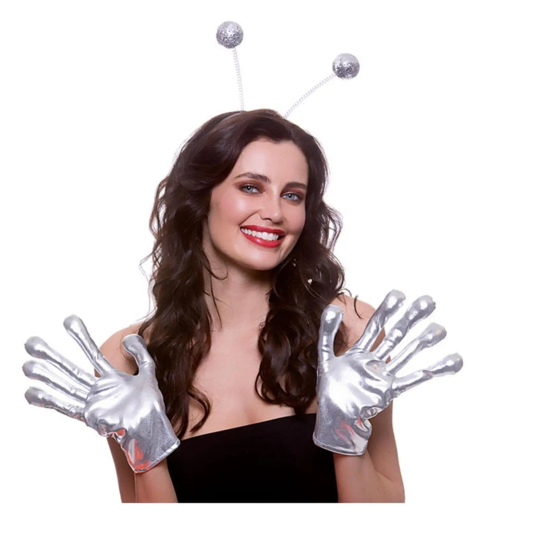 Woman wearing a pair of silver alien gloves for fancy dress space costumes