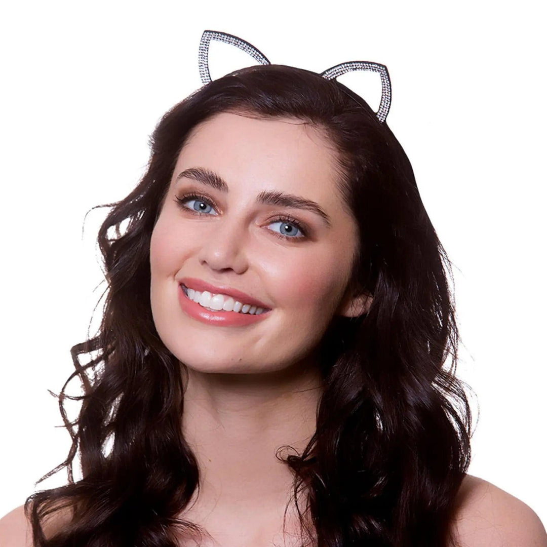 Lady with black hair wearing a set of diamante cat ears on a headband for fancy dress parties