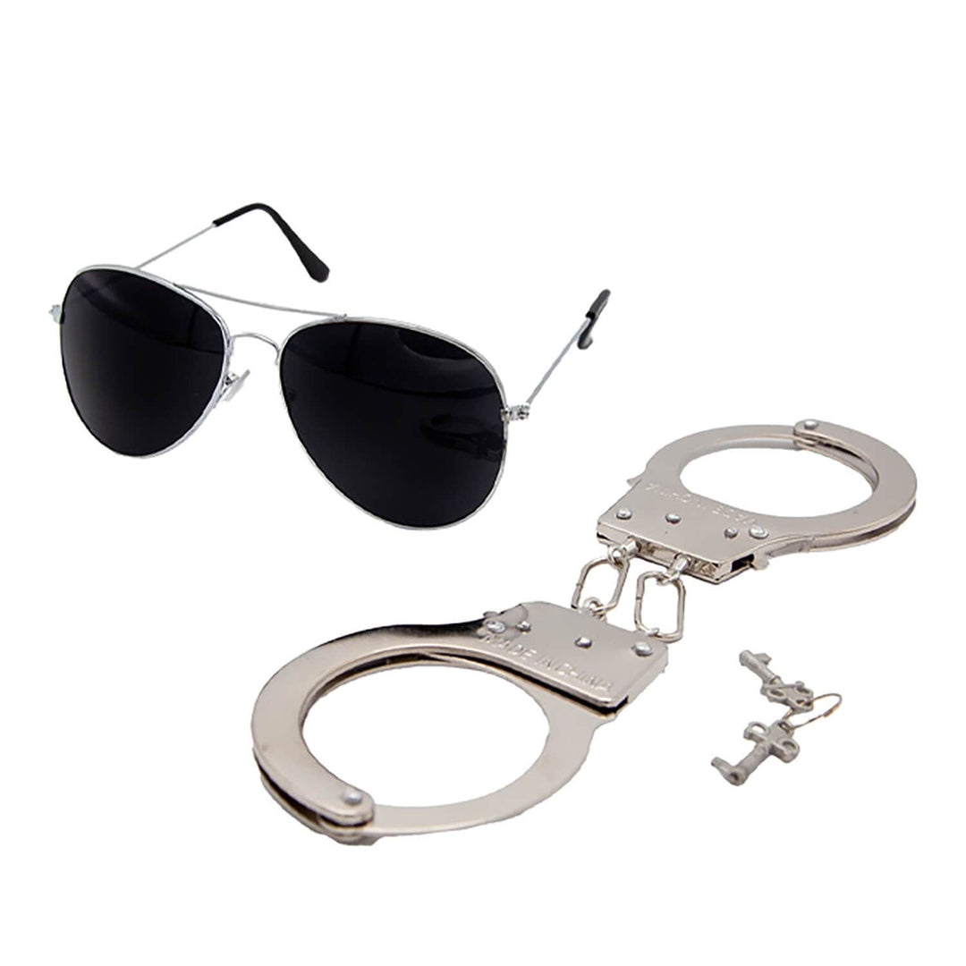 Aviator sunglasses with black lenses and silver frames, paired with police handcuffs on a white background.