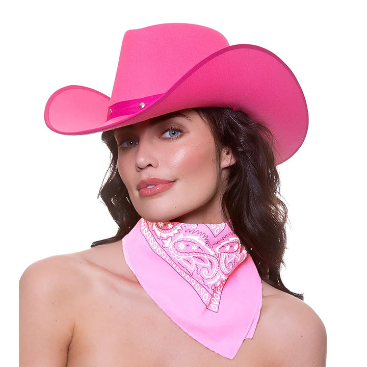 Lady wearing a bright pink cowby hat with a baby pink and white neckerchief bandana