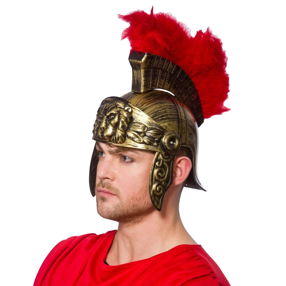 Man wearing an antique bronze roman soldier helmet with red feather top for fancy dress costumes