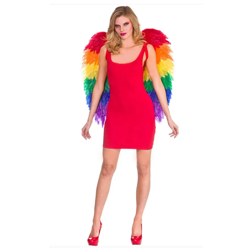 Woman in a red dress wearing rainbow coloured feather wings for Pride and festivals