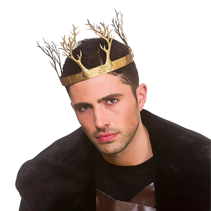 Man wearing a gold woodland crown with gold trees