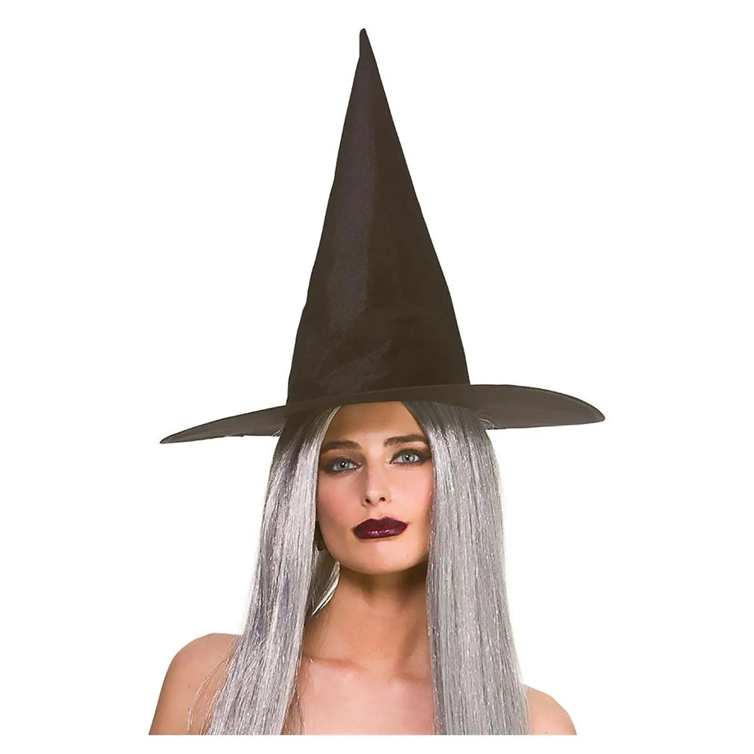 Woman with long grey hair wearing a big pointy witch hat for Halloween fancy dress costumes