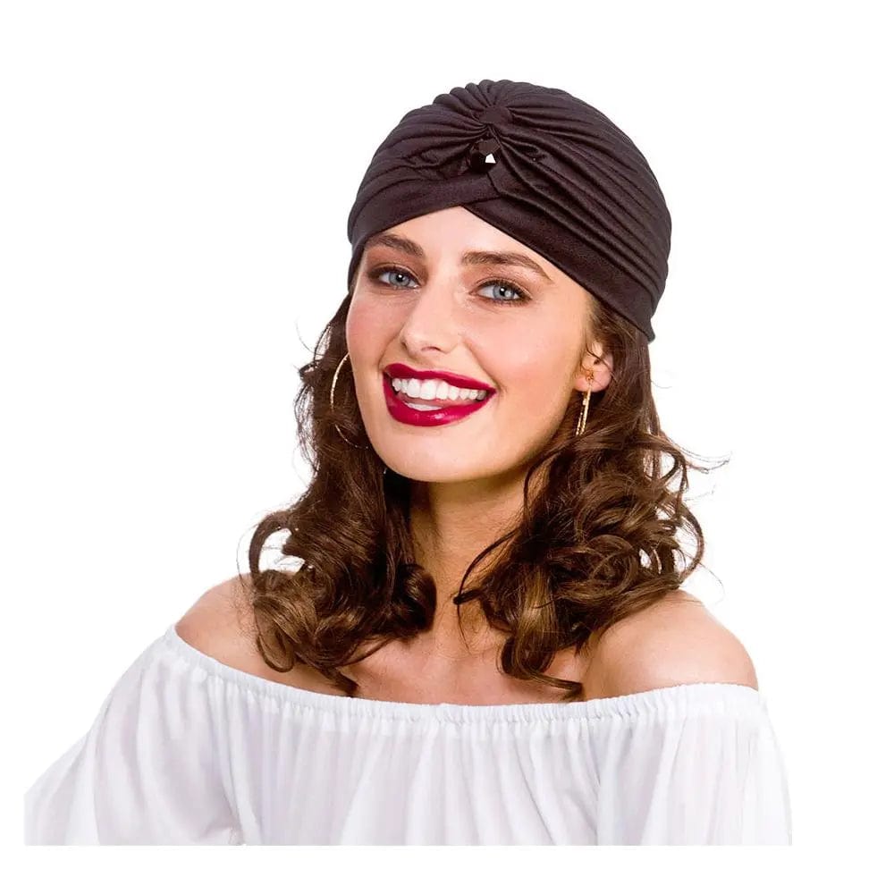 Woman wearing a white top, hoop earrings and a black turban for gypsy fancy dress costumes