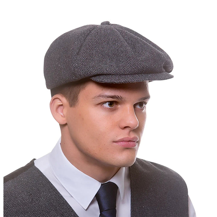 Man wearing a grey flat cap, baker boy hat for Peaky fancy dress costumes