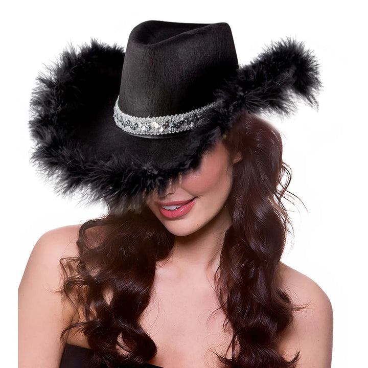 Lady wearing a black cowgirl hat with silver sequins hat band and black feather trim