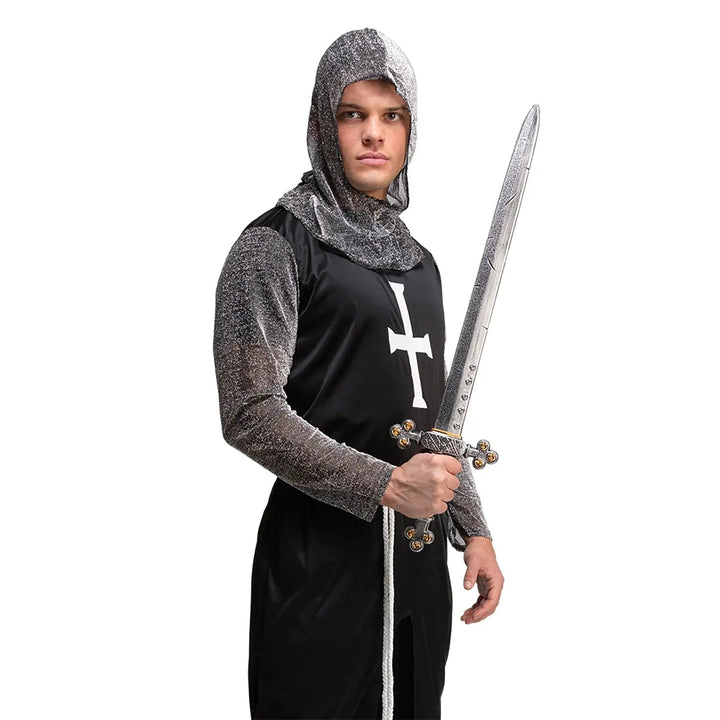 Man dressed up as a medieval knight with large silver sword for fancy dress parties