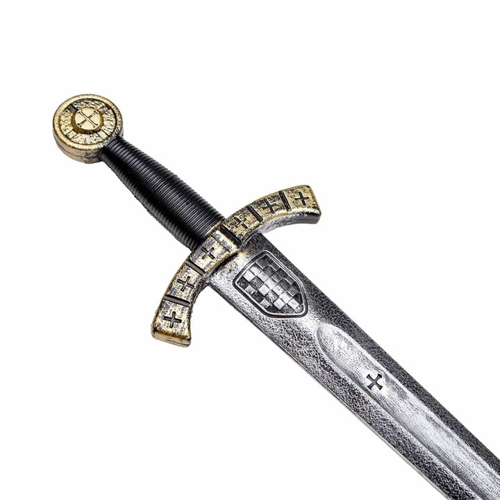 Close up of the handle on a plastic sword with medieval Christmas cross and symbols