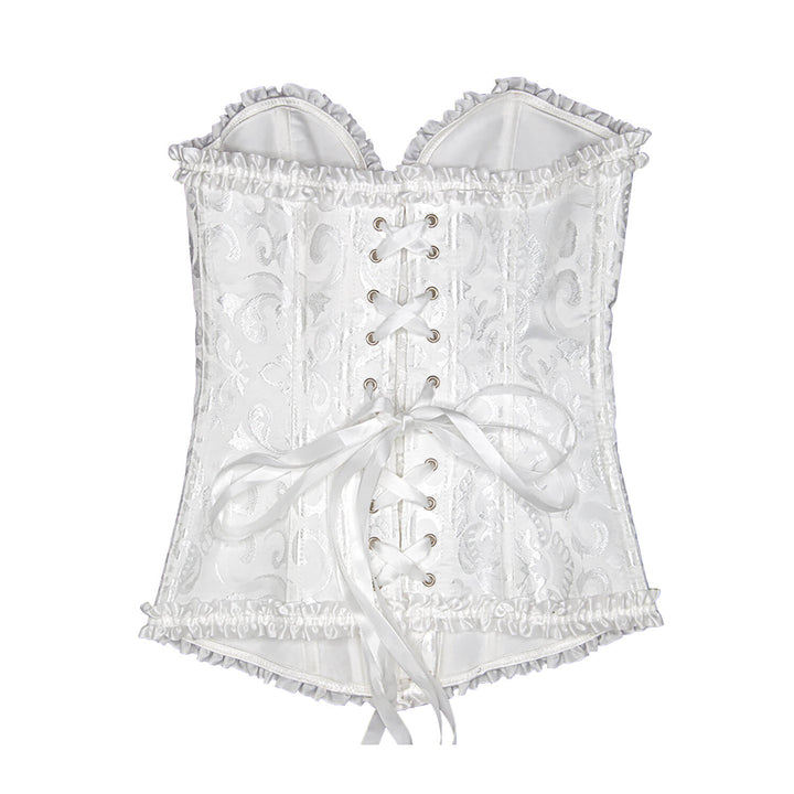 Detail of cross ribbon fastening on the back of a white costume corset