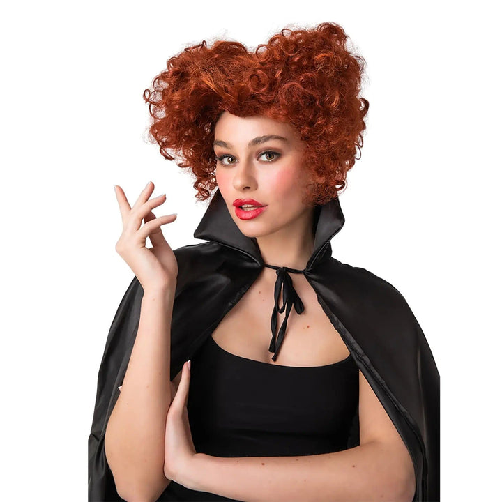 Female model wearing a red heart shaped wig with curly hair for comedy witch fancy dress costumes 