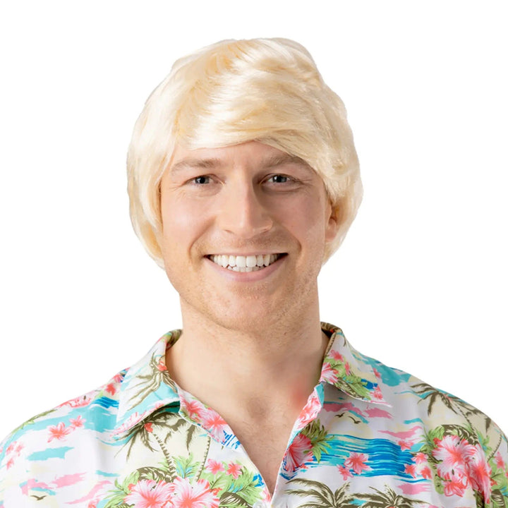 Man wearing a blonde short hair wig and colourful Hawaiian shirt for a fancy dress, beach party or Halloween