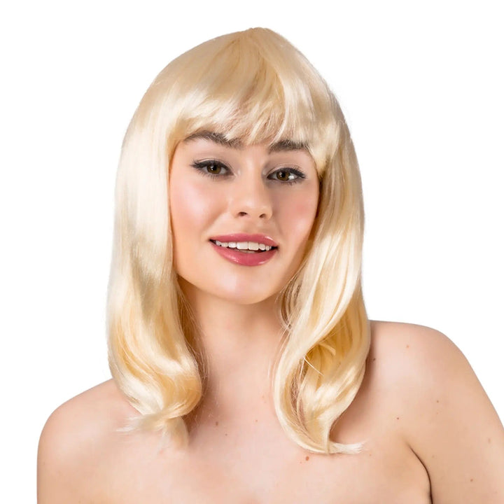 Young lady wearing a long blonde wig with fringe for Halloween fancy dress costumes