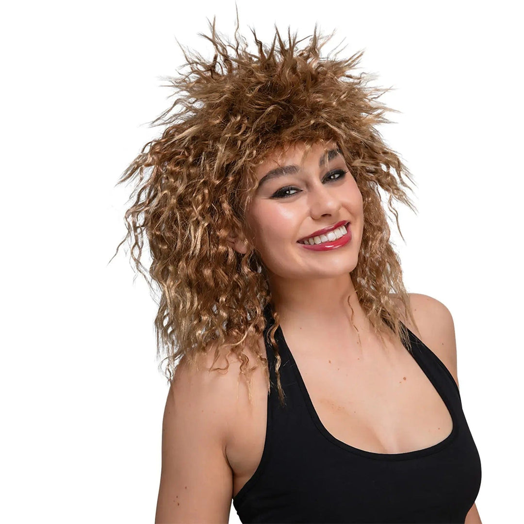 Lady wearing a big curly hair mullet wig to look like Tina Turner