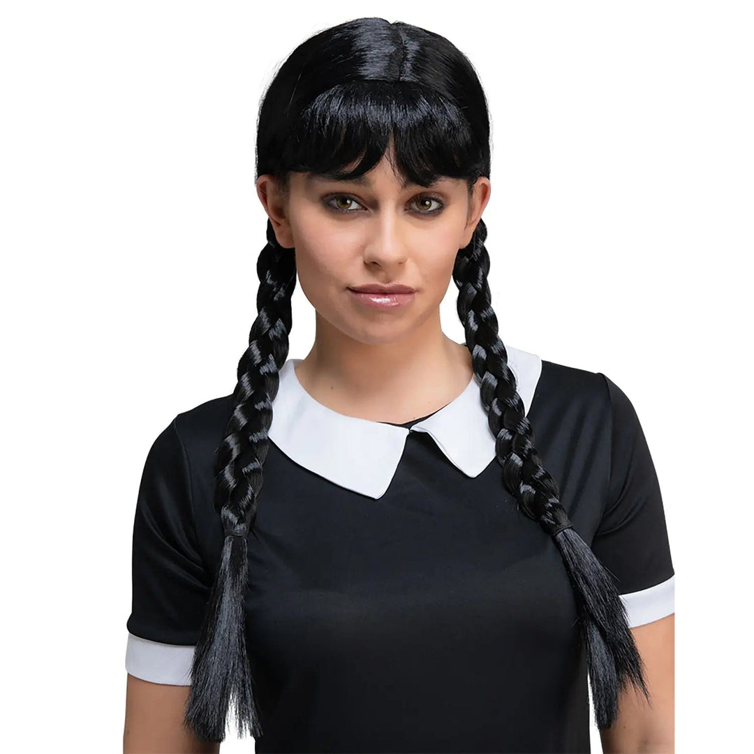 Young lady wearing a black wig with braided pigtails for Wednesday Addams fancy dress costume