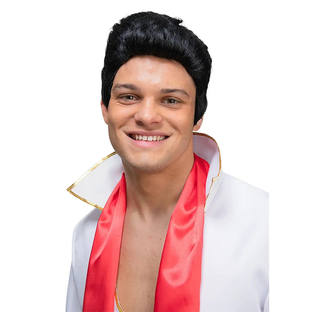 Man dressed as Elvis with a black wig, white shirt and red scarf for fancy dress parties