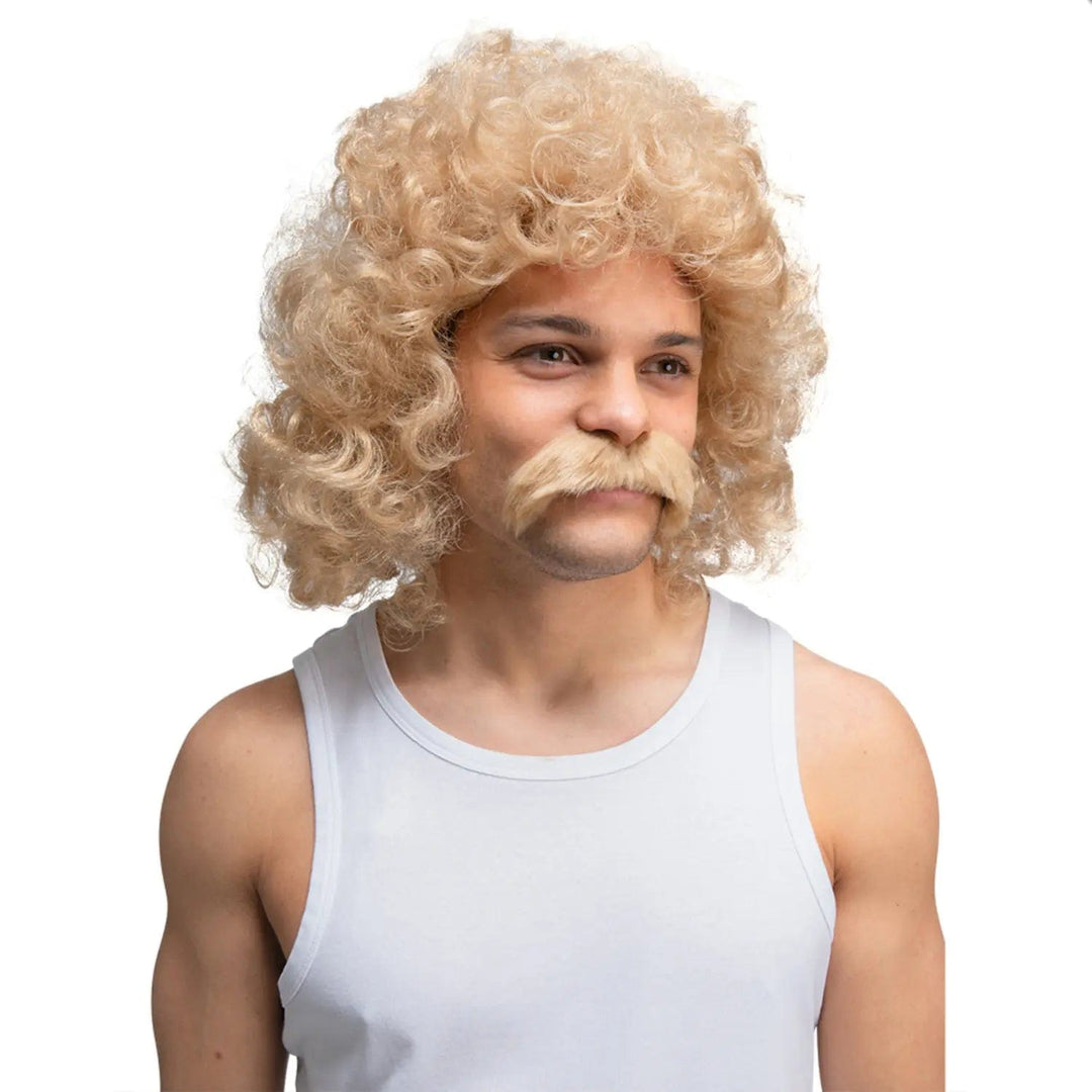 Man wearing a white vest and a blonde bubble perm wig with blonde thick moustache for fancy dress costumes