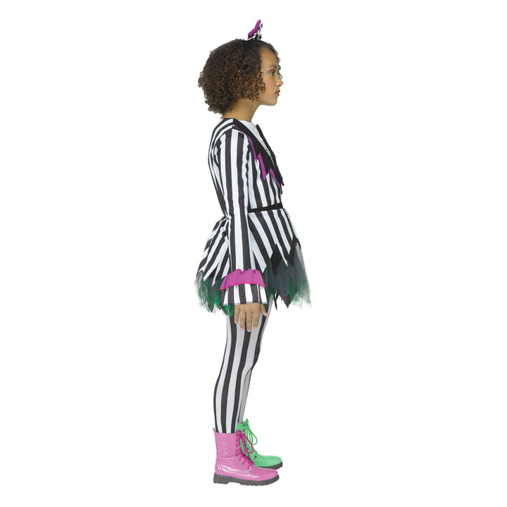 A child model shown in profile wearing a black and white striped costume with green and pink accents, black-and-white striped tights, green and pink lace-up boots, and hair bow, on a plain white background.