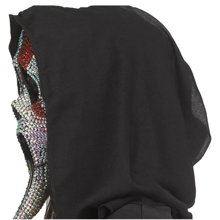 A close-up of a black hooded garment or mask with a heavily embellished side panel covered in iridescent rhinestones, shown against a plain white background.