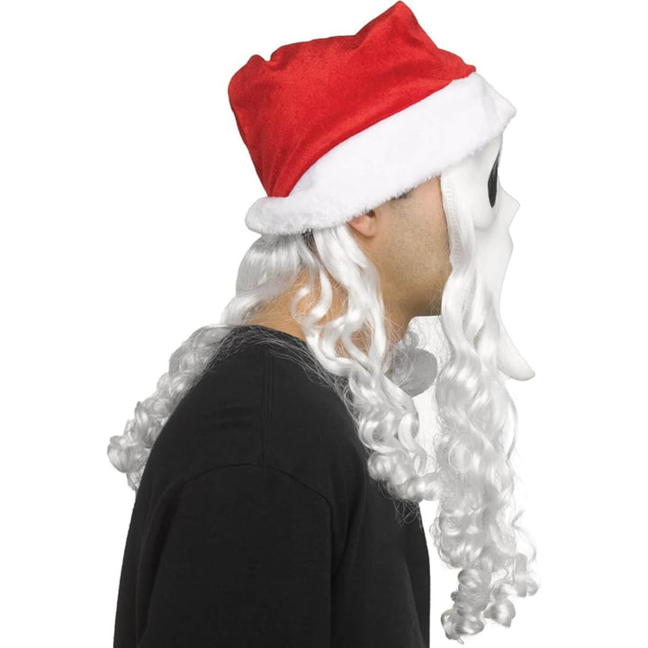 A person shown in side profile wearing a Santa hat with a long white curly wig and beard, against a plain white background.