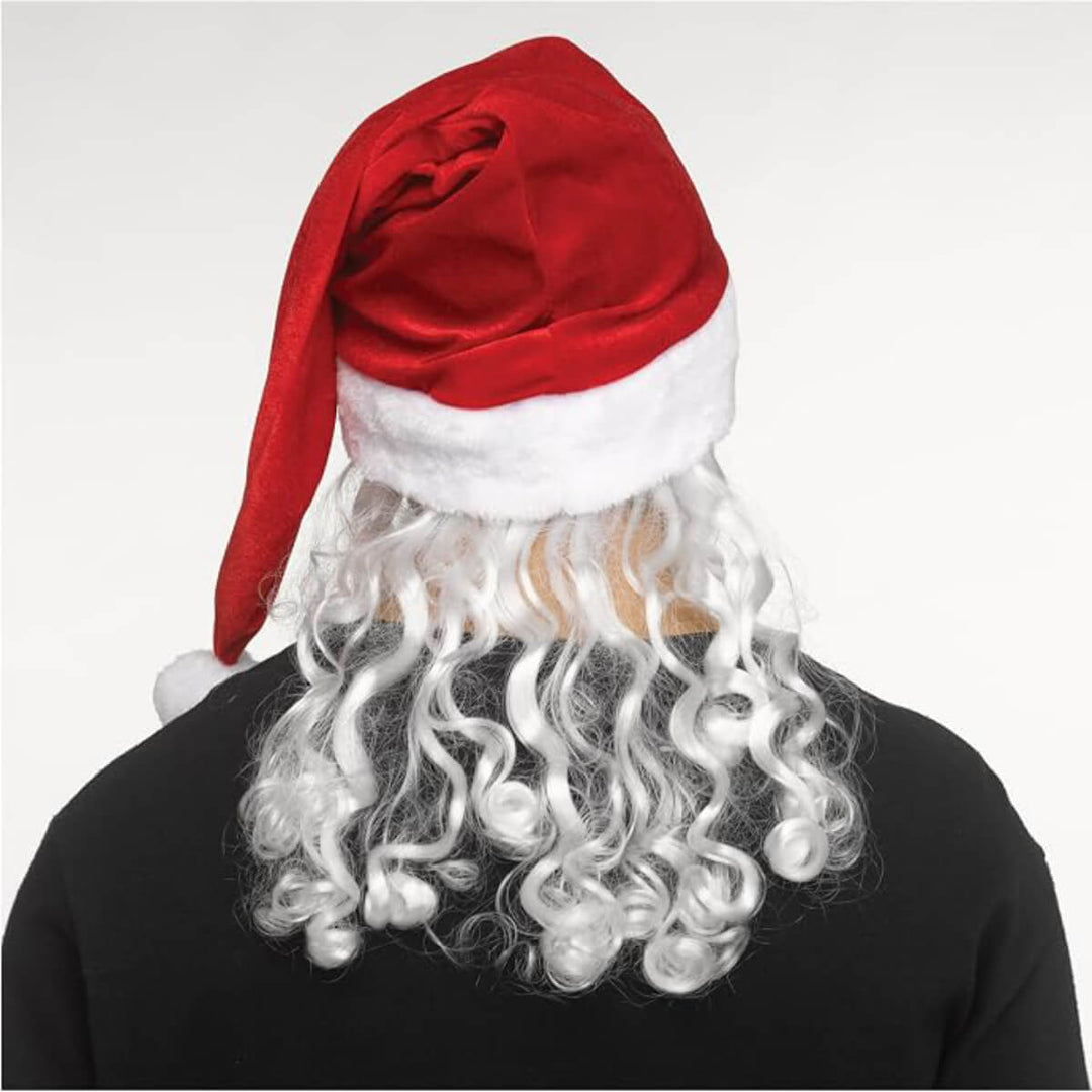 Back view of a person wearing a Santa hat and white wig on a plain background
