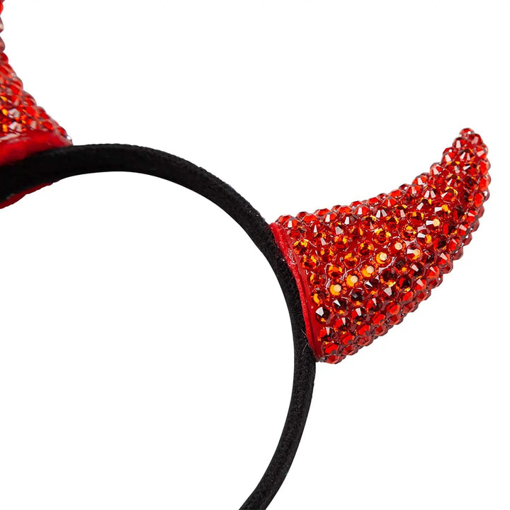 Close up of a red devil horn covered in diamante for Halloween sparkle