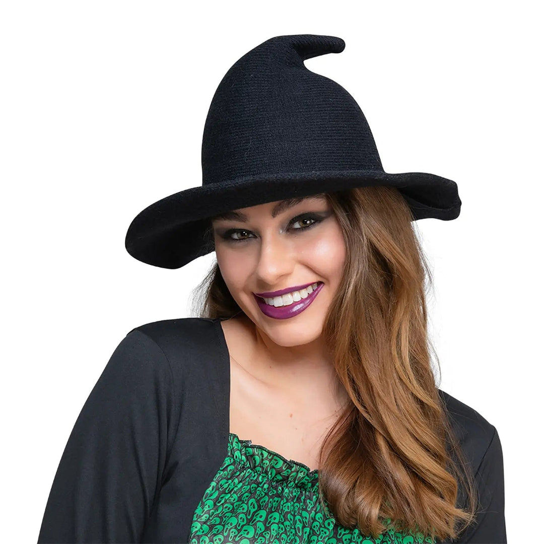 Woman wearing a black knitted fabric witch hat for Halloween