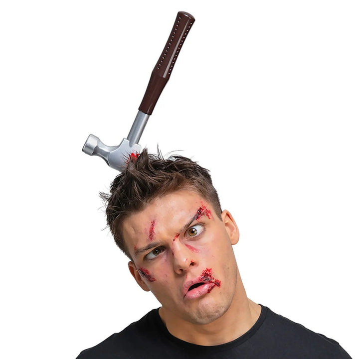 Man wearing a horror hammer headband for Zombie Halloween fancy dress costumes