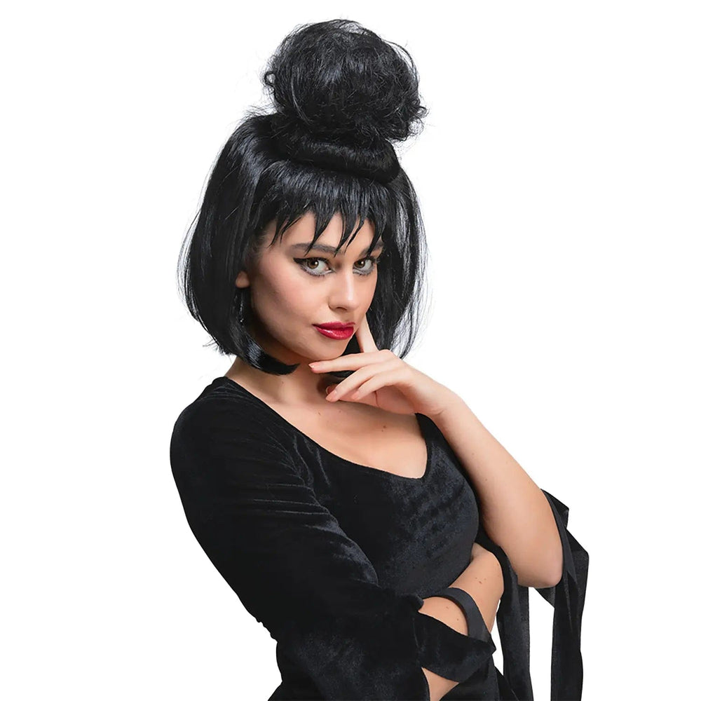 Woman wearing a black wig with bun on top and jagged fringe for Halloween and fancy dress costumes