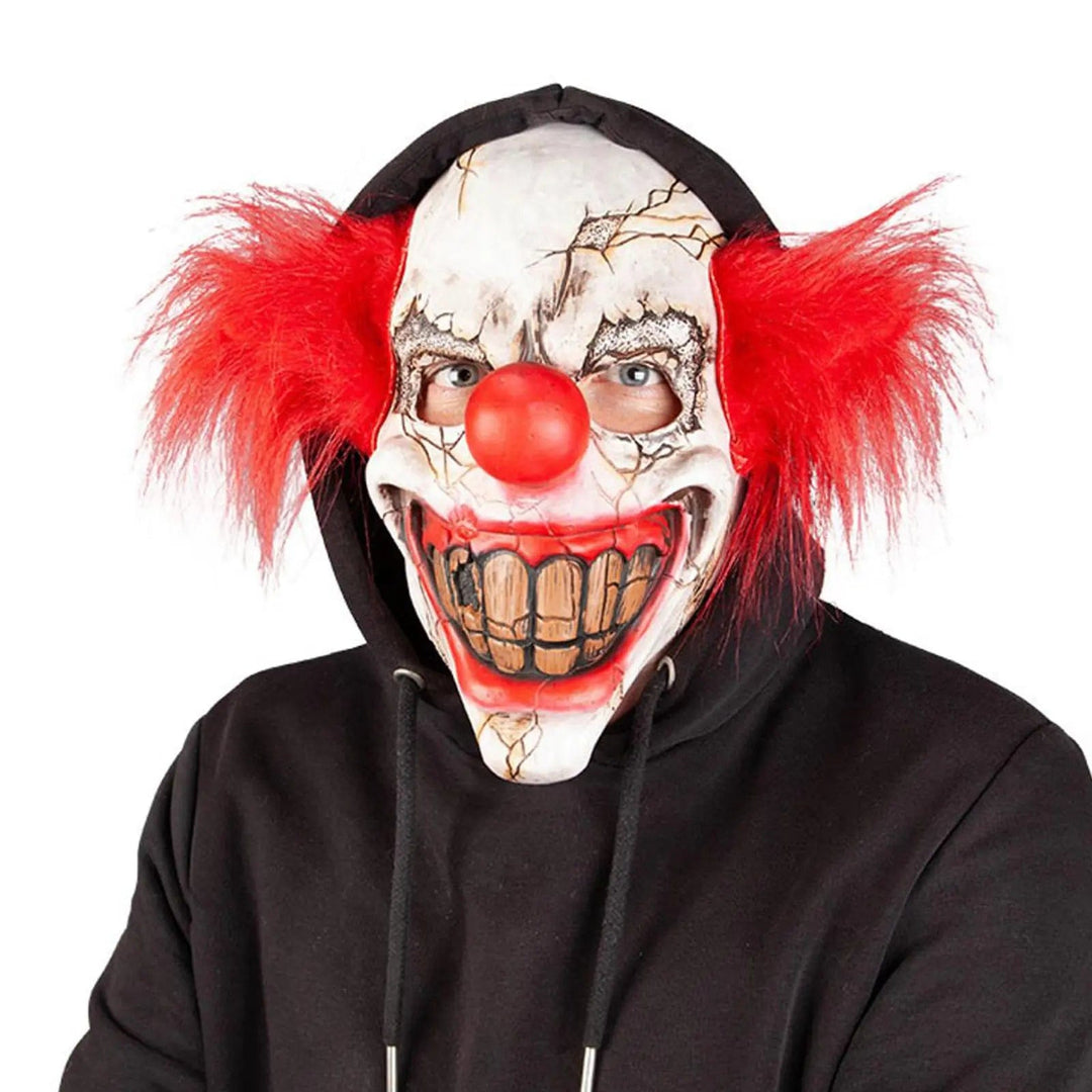 Vintage Circus Clown mask with red tufts of hair, huge evil grin and big red nose for Halloween fancy dress costumes