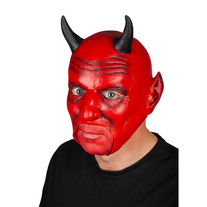 Man wearing a red devil mask with horns and cut away mouth for Halloween costumes