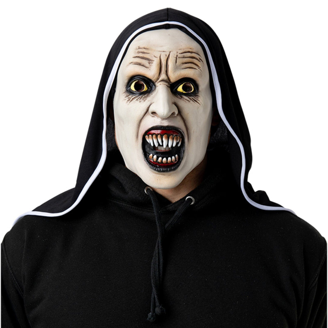 Adult wearing an evil nun mask with black habit for religious horror Halloween costumes