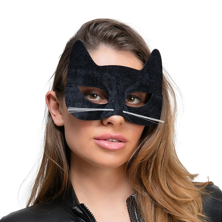 Model wearing a black cat eye mask in black velour with white whiskers