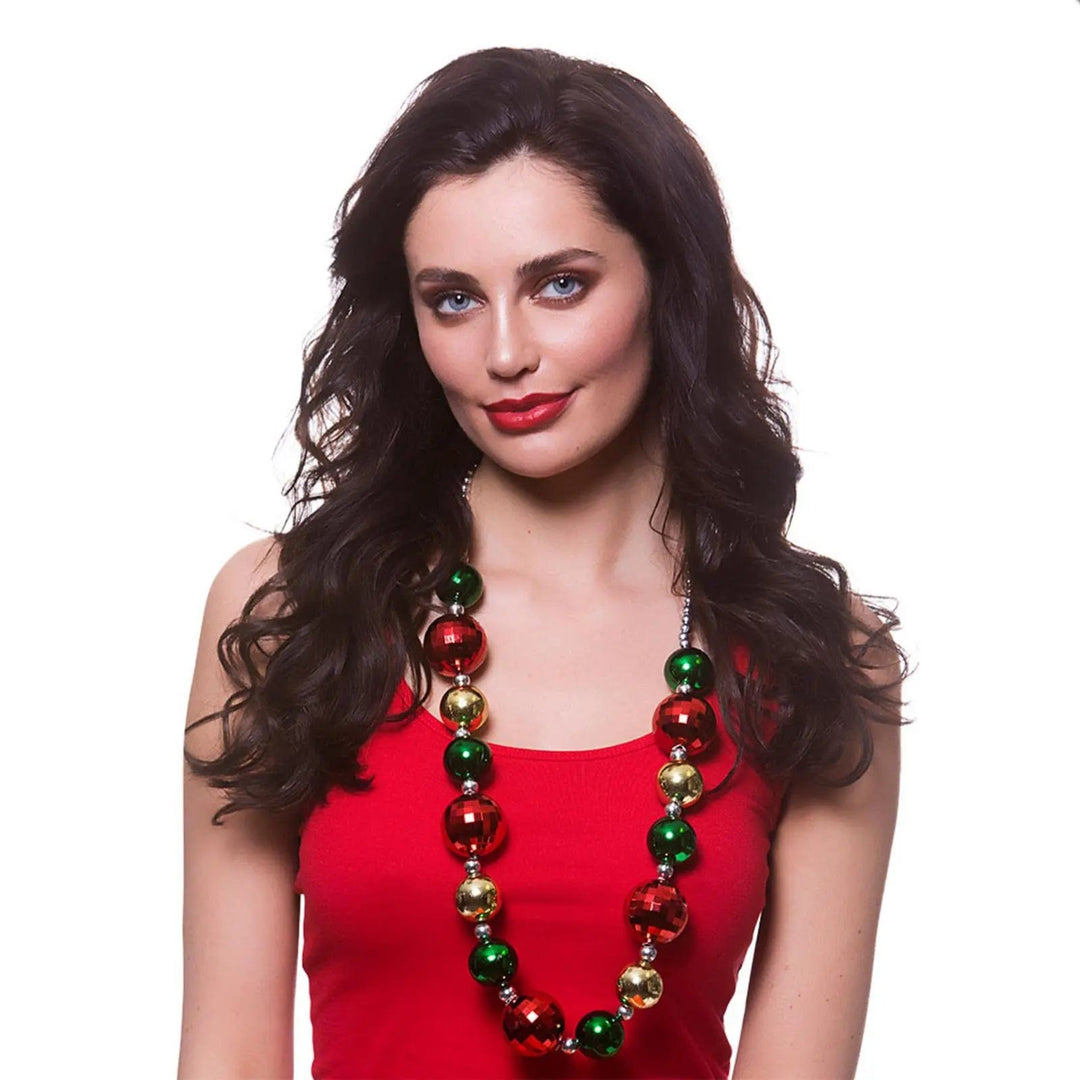 Lady wearing a Christmas necklace with red, green and gold baubles for Christmas parties