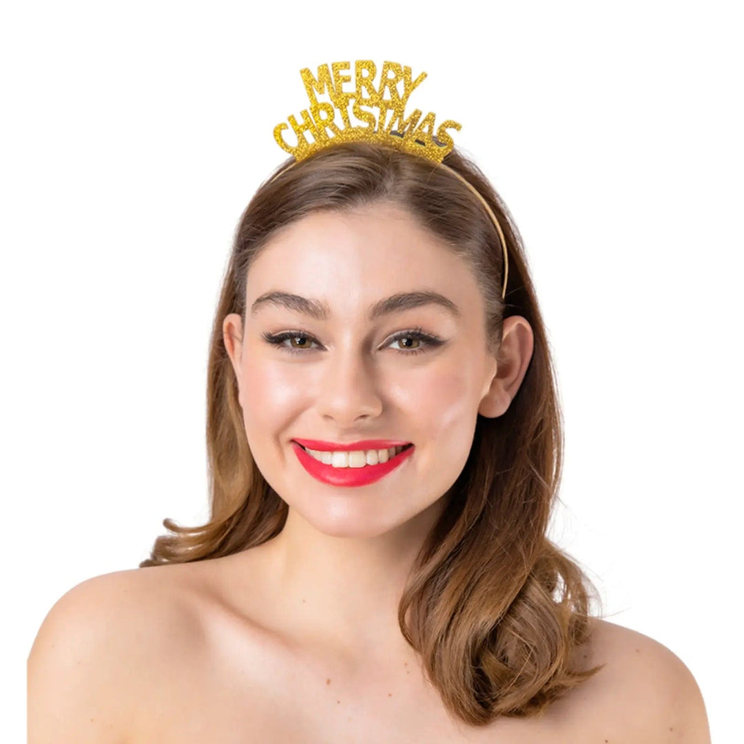 lady wearing a gold headband with Merry Christmas lettering covered in gold glitter