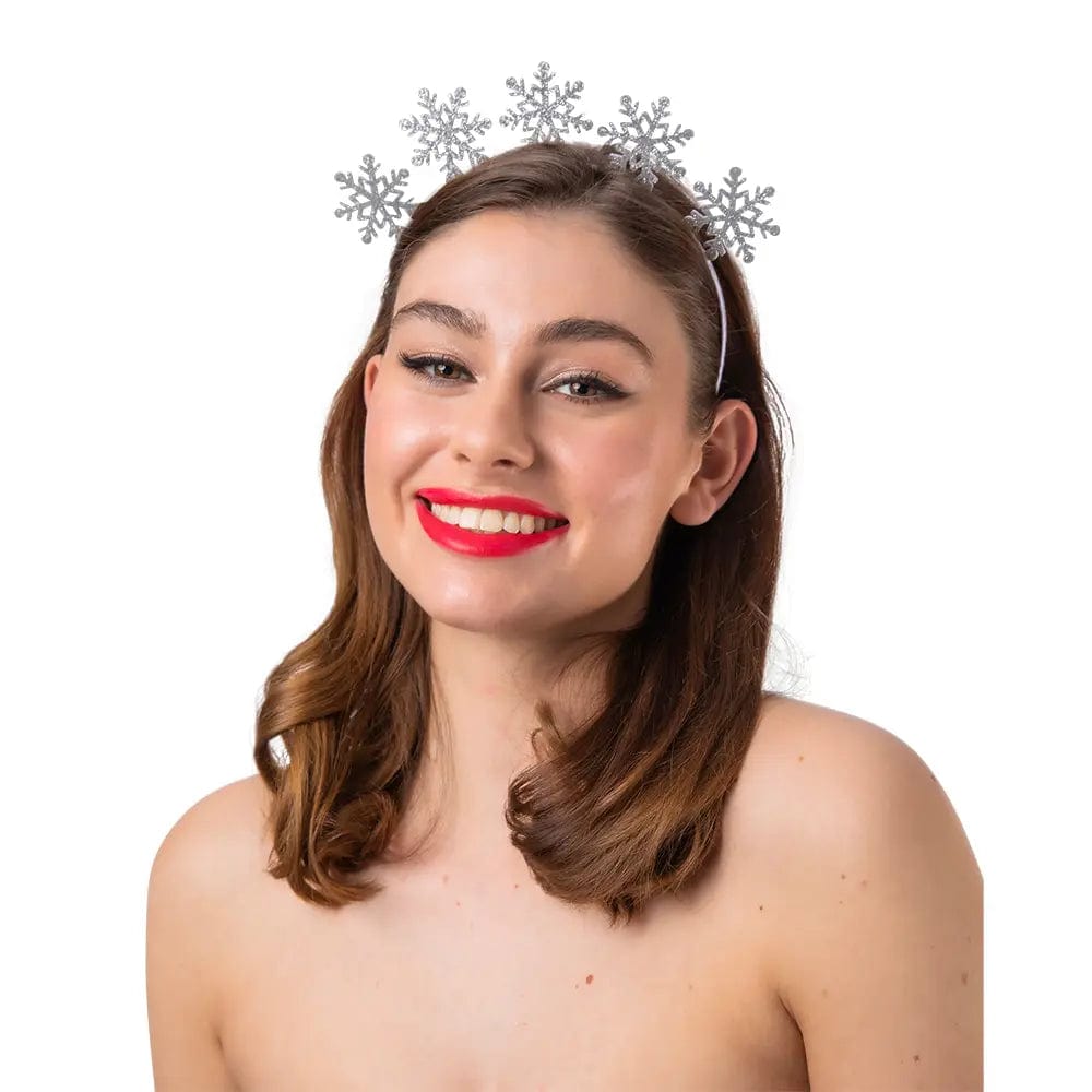 Young lady wearing a silver headband with 5 glitter snowflakes for Christmas parties