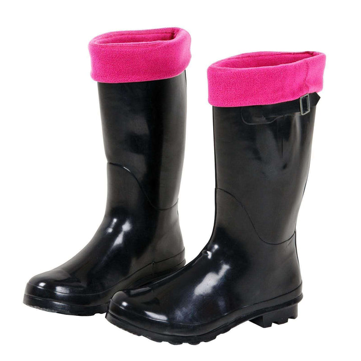 Black rubber boots with bright pink cuffed tops of sock liners on a white background