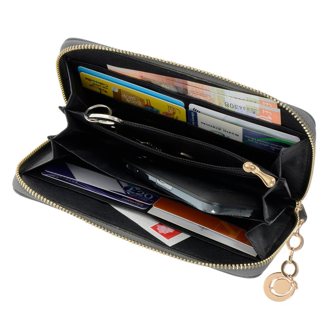Black purse with gold zip and key pull open to show card slots on a white background
