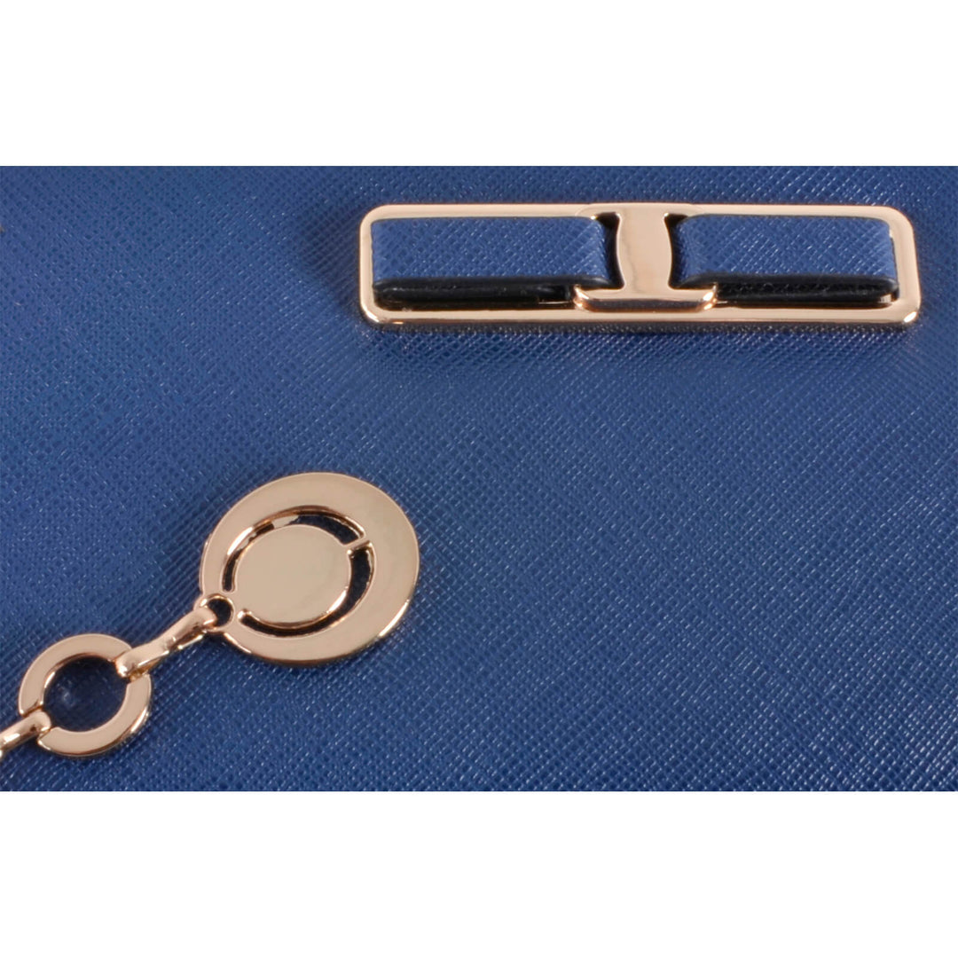 Close-up of a blue PU faux leather surface with a gold metal clasp and chain.