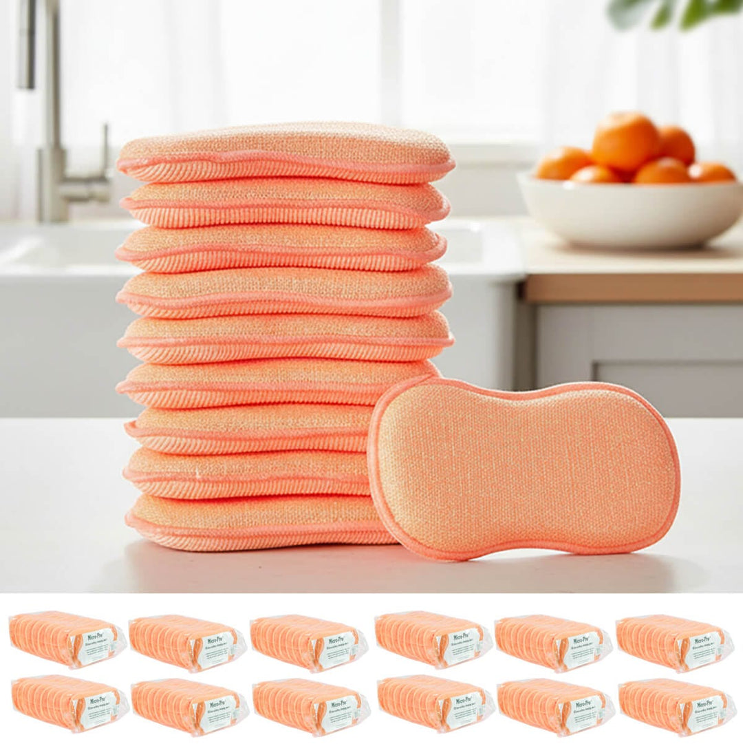 Stack of orange coloured reusable cleaning pads with a single pad on a kitchen counter.