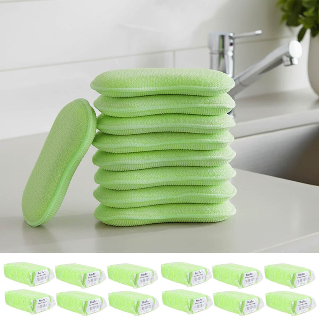 Stack of green cleaning pads on a kitchen counter with a sink tap in the background.