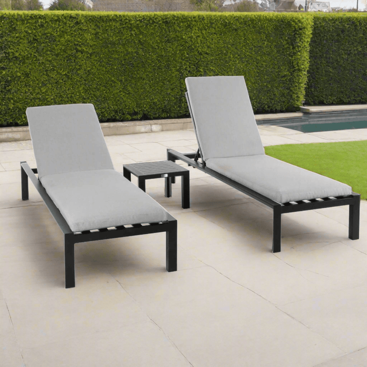 Grey Sunloungers in a Beautiful Poolside garden setting