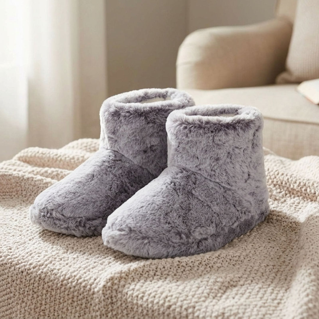 faux fur boot slippers on blanket in front of sofa in living room
