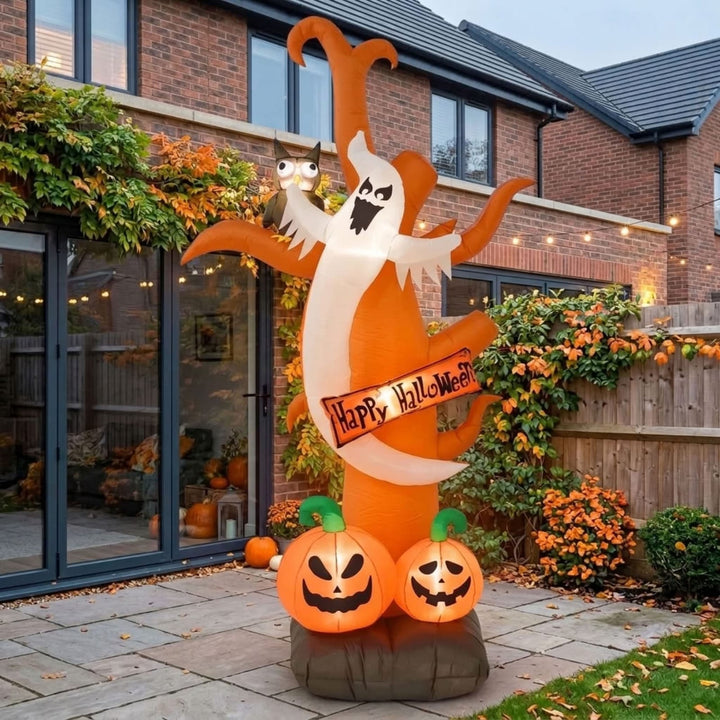An inflatable Halloween yard decoration stands in a residential backyard. The decoration features a large orange and white ghost holding a &