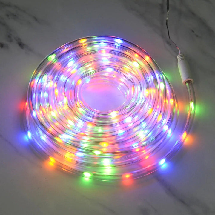 multicoloured LED rope light coiled on a marble floor for Christmas decorations