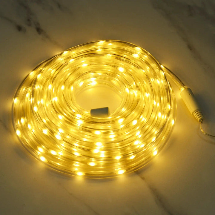 warm white LED rope light coiled on a marble floor