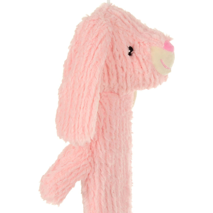 Side view of a plush pink rabbit head hot water bottle on a white background