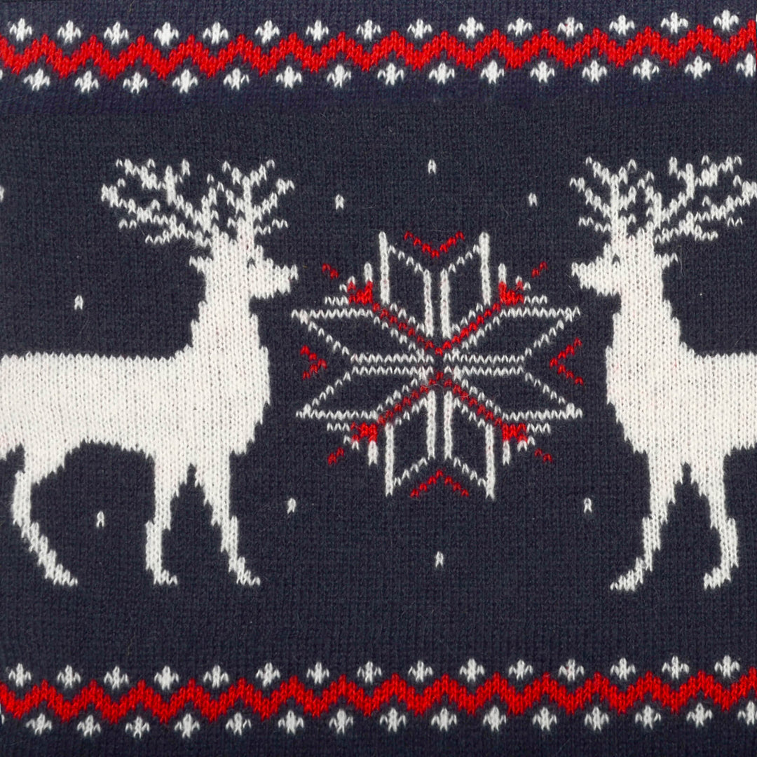 Close up of a Christmas knitted reindeer and snowflakes pattern in navy red and white